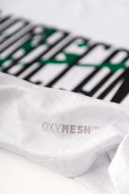 Close-up of the Lions Wear Moroccan AURA jersey showing OXYMESH™ breathable fabric and a partial view of the front print design.