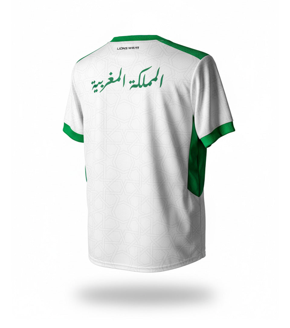 Back view of the Lions Wear Moroccan AURA white and green football jersey with Arabic text ‘Kingdom of Morocco’ — CAN 2025 supporter apparel.